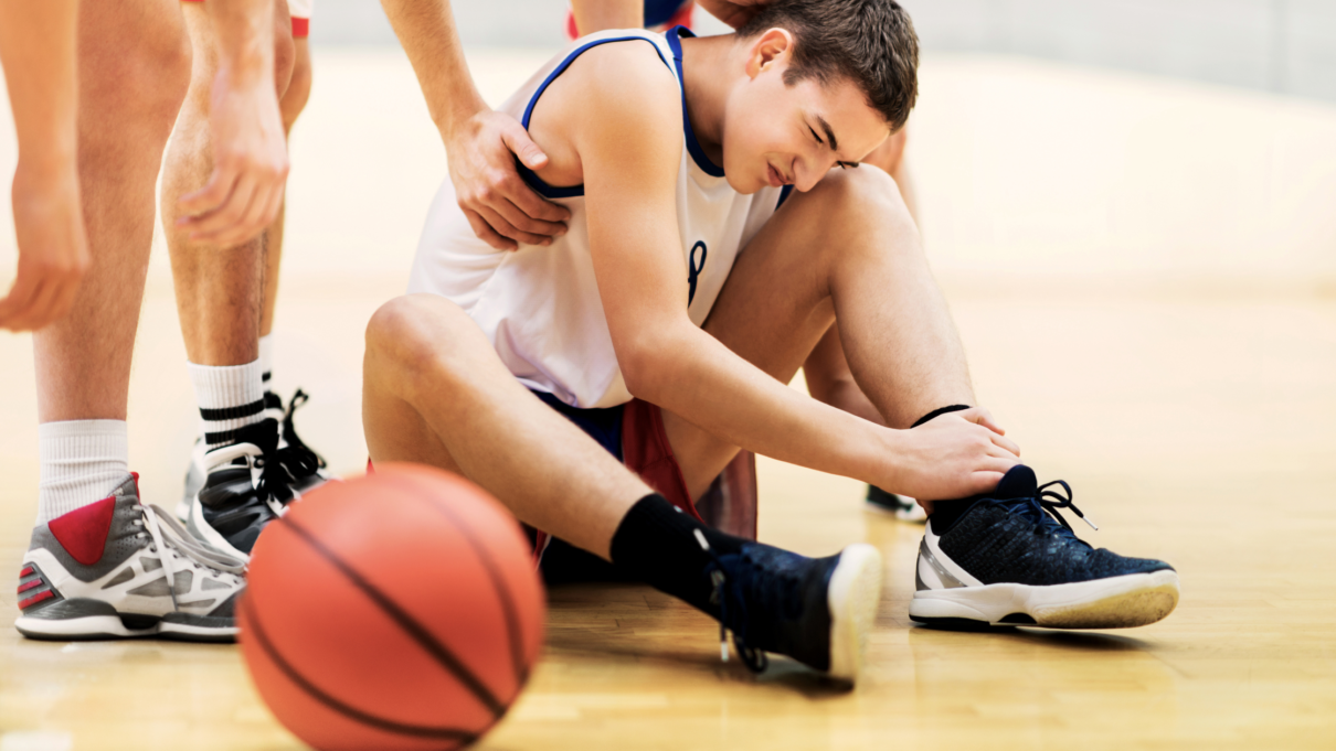 boy suffering from basketball injury