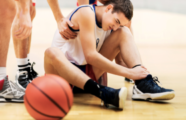 boy suffering from basketball injury